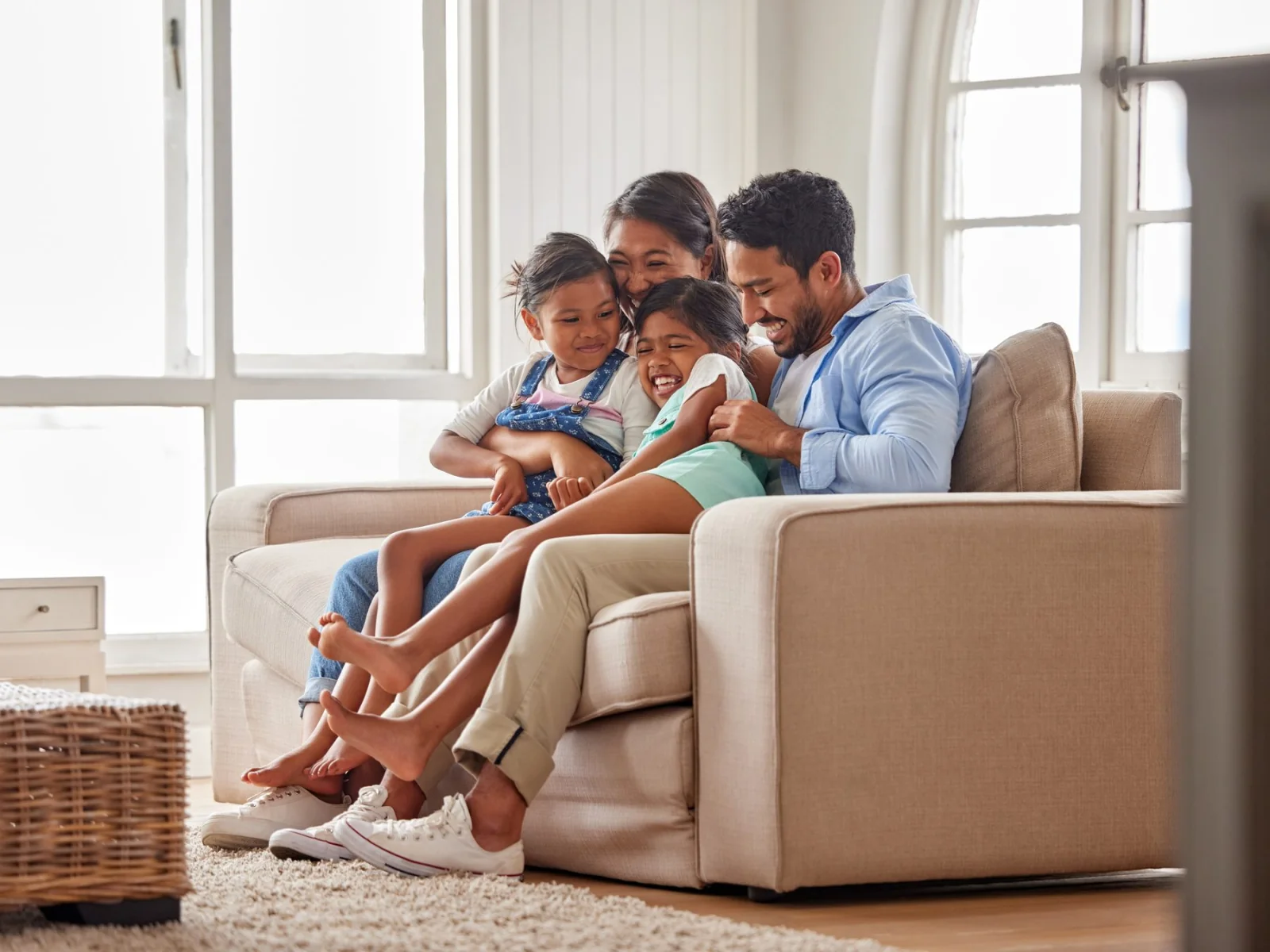 A family together in the living room of their home
